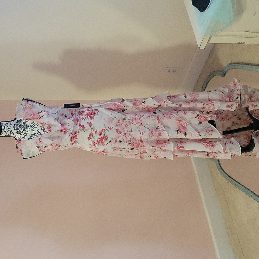 Beautiful flowy wrap dress short in the front long back.
